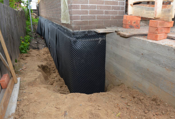 Happy homeowners after waterproofing job in Minetto